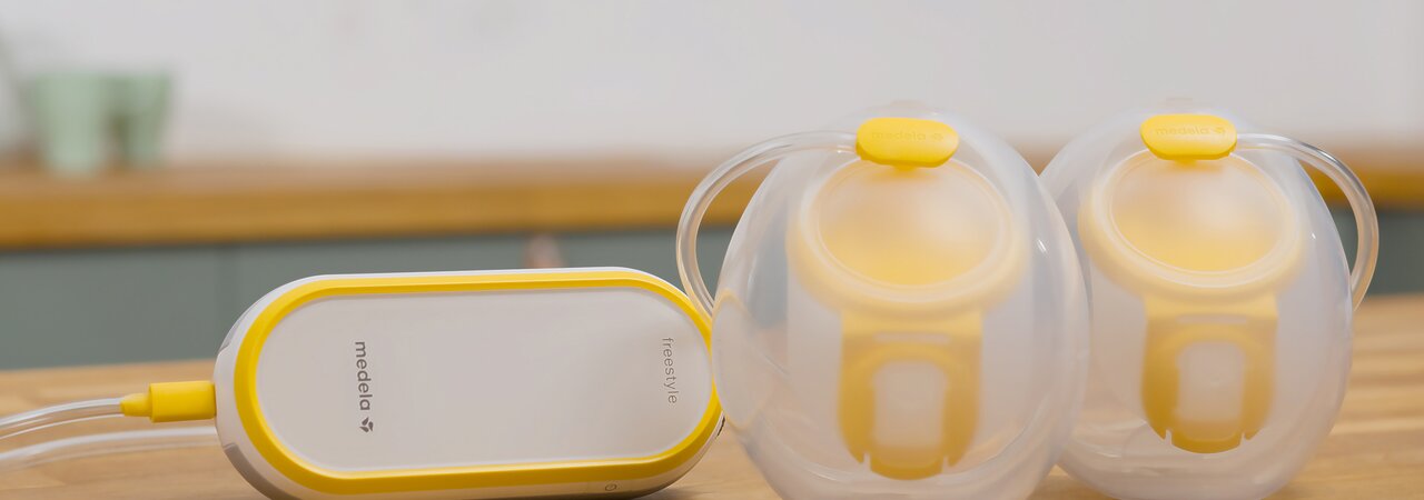 Medela Freestyle™ Hands-free double electric wearable breast pump sitting on counter