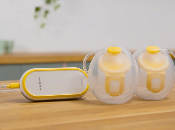 Medela Freestyle™ Hands-free double electric wearable breast pump sitting on counter