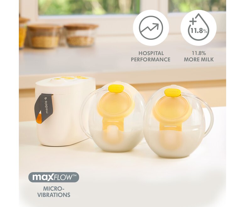 Medela Pump In Style® Hands-free double electric breast pump with Hands-free collection cups filled with milk sitting on counter.  Text on image, "Hospital performance, 11.8% more milk, MaxFlow Micro-Vibrations"