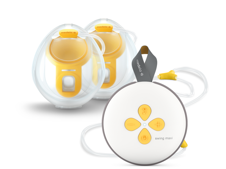Tire-lait électrique double Swing Maxi™ de Medela, gobelets de recueil et tubulure mains libres.