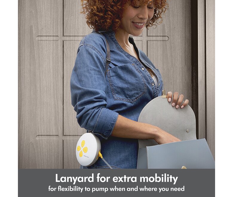 Woman walking out door wearing her Medela Swing Maxi™ double electric breast pump. Text below image reads, Lanyardd for extra mobility for flexibility to pump when and where you need"