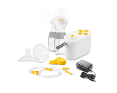 Pump In Style Pro breast pump, connector, breast shields, caps, tubing, and power adapter.
