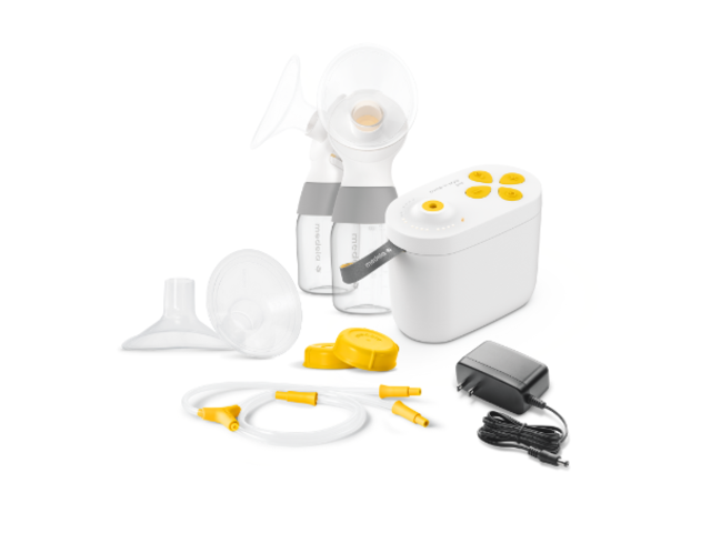 Pump In Style Pro breast pump, connector, breast shields, caps, tubing, and power adapter.