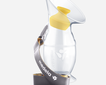 The Medela Silicone breast milk collector with stopper and lanyard.