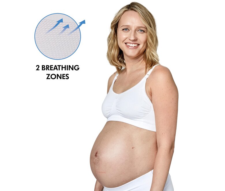 Maman portant un Medela Keep Cool™ Bra blanc vue de côté avec le texte, « 2 breathing zones ».