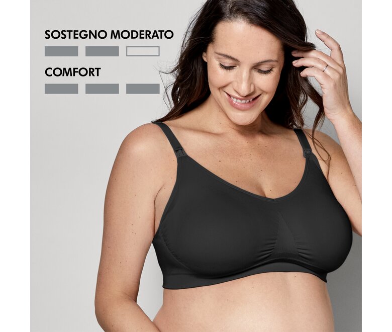 Donna che indossa un reggiseno Medela Keep Cool™ Ultra nero vista frontale con i testi “Moderate Support” e “Comfort”.