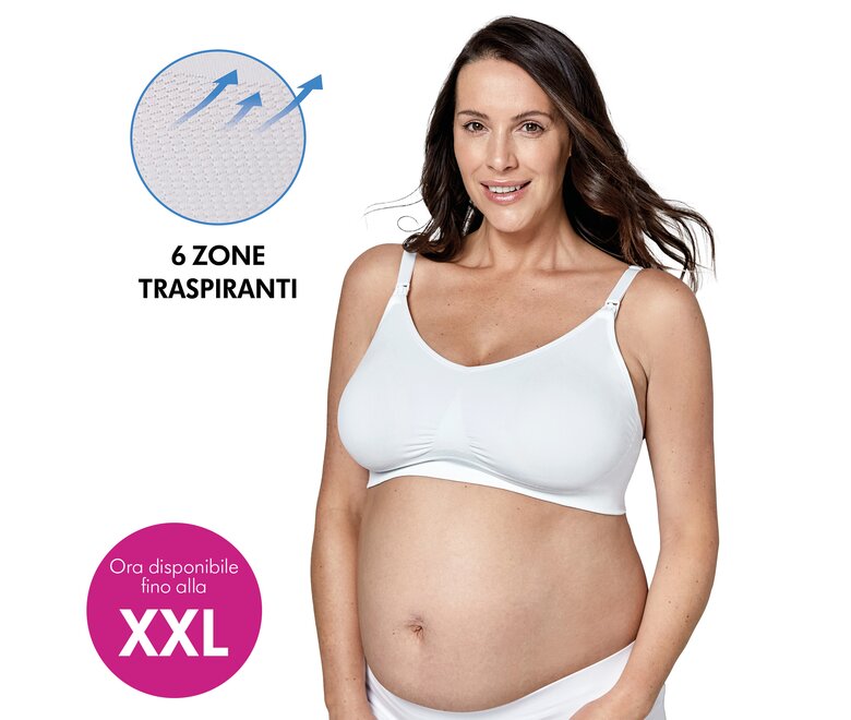 Una donna indossa un reggiseno Medela Keep Cool™ Ultra bianco, con il testo “6 zone traspiranti” e “Ora disponibile fino alla XXL”.