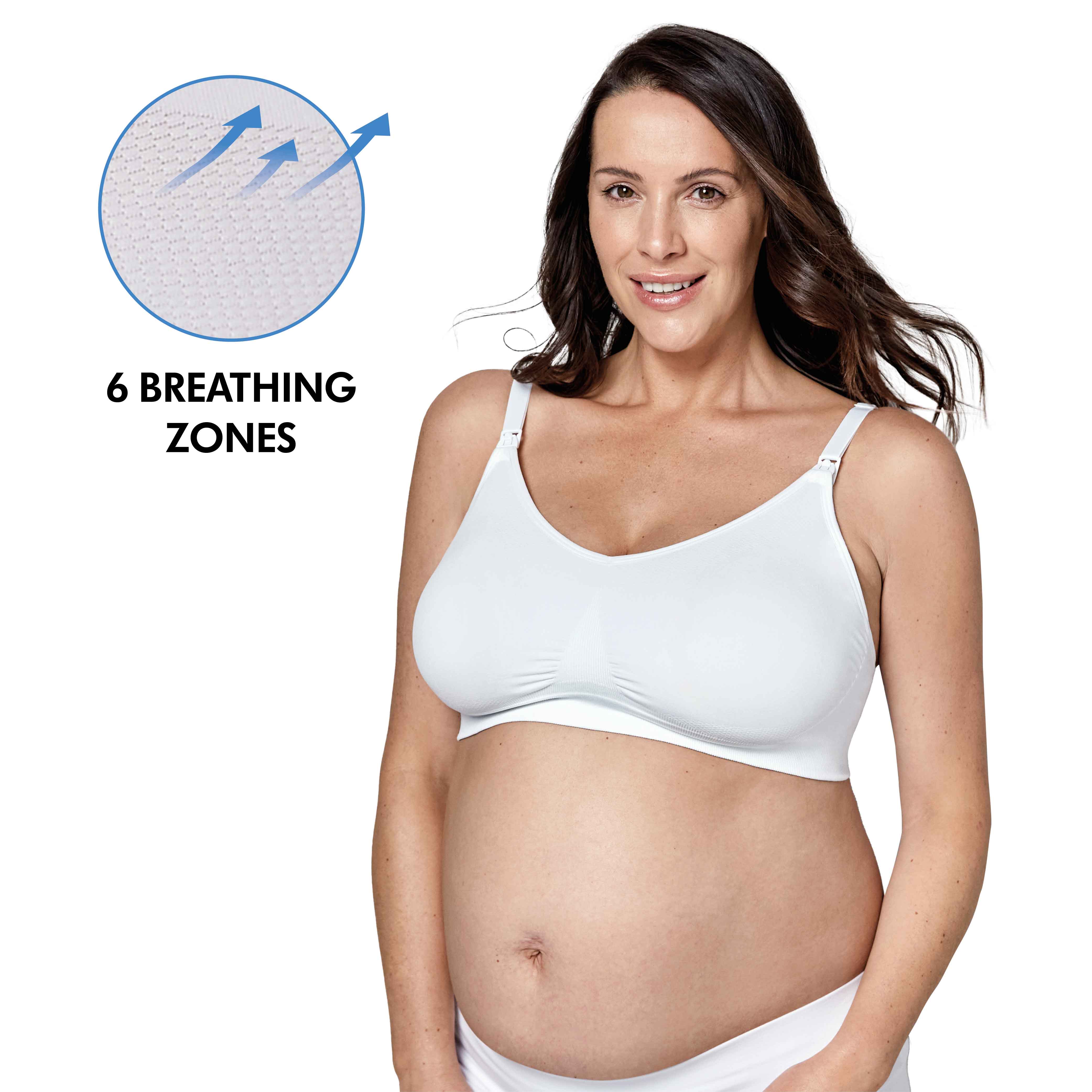 Woman wearing a white Medela Keep Cool™ Ultra Bra front view with text, "6 breathing zones"