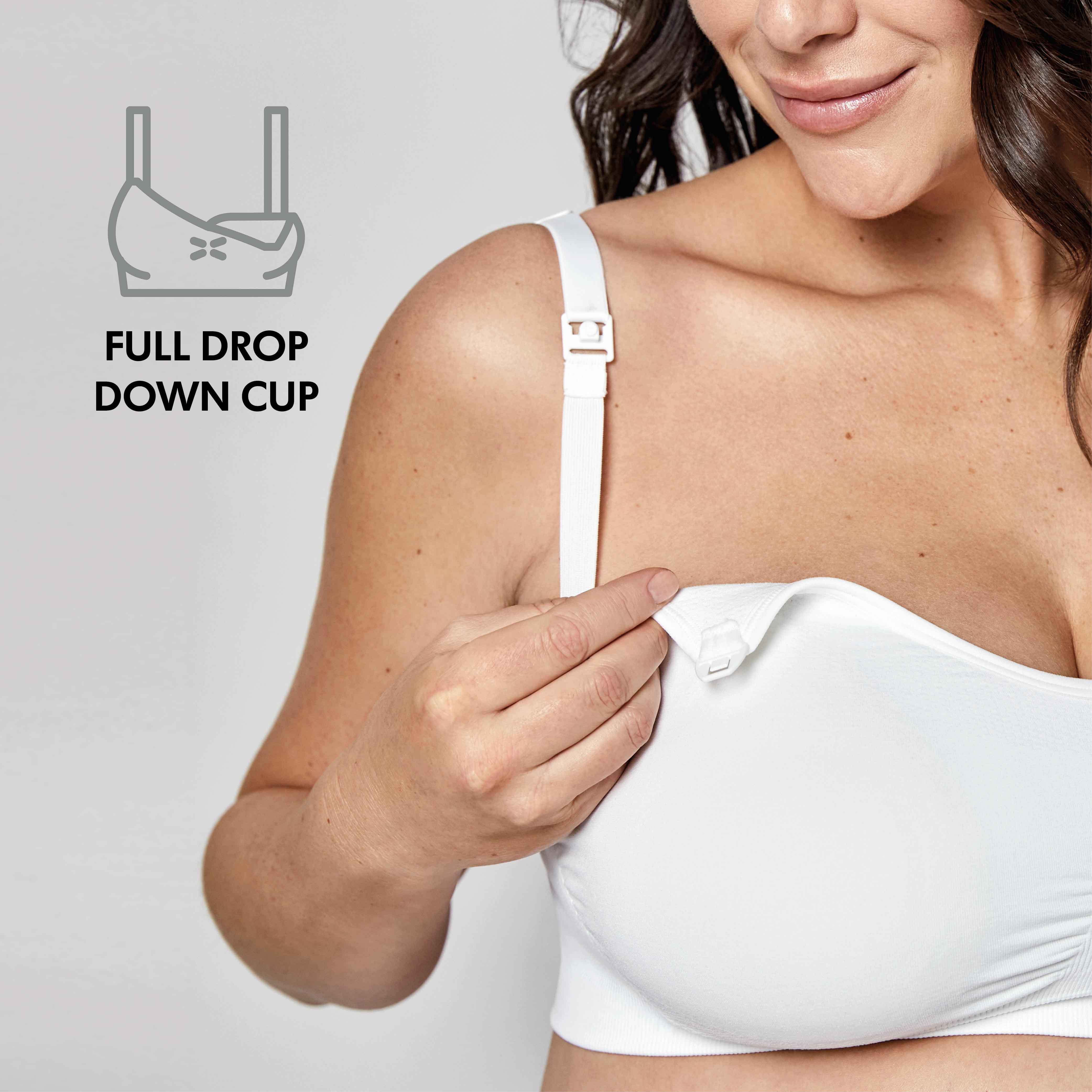Woman wearing a white Medela Keep Cool™ Ultra Bra front view with text, "Full drop down cup"