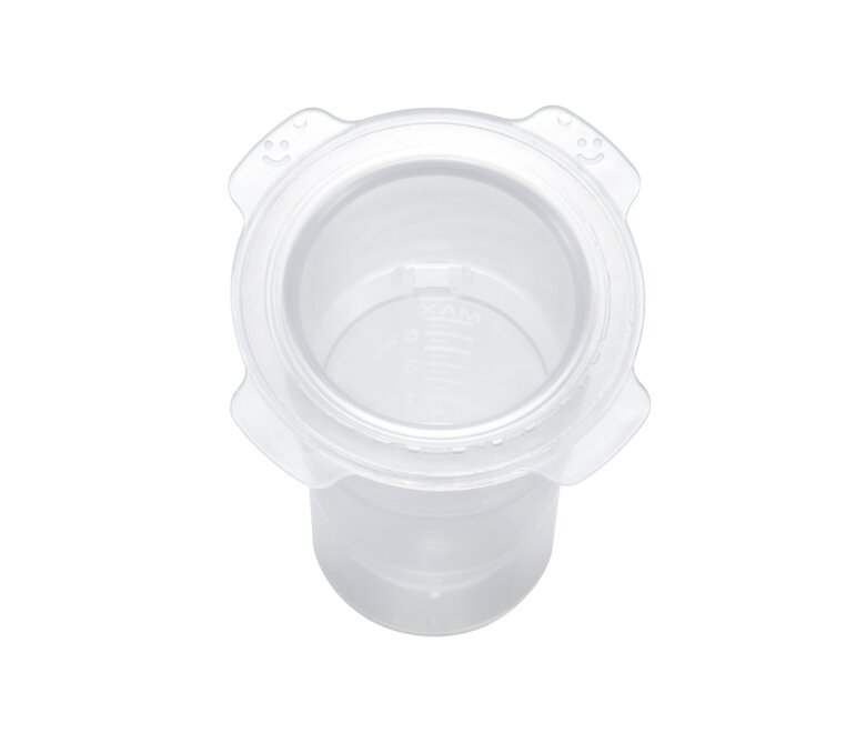 It is important the smiley faces on the Colostrum Protector face up as this direction orients the vent hole upwards.