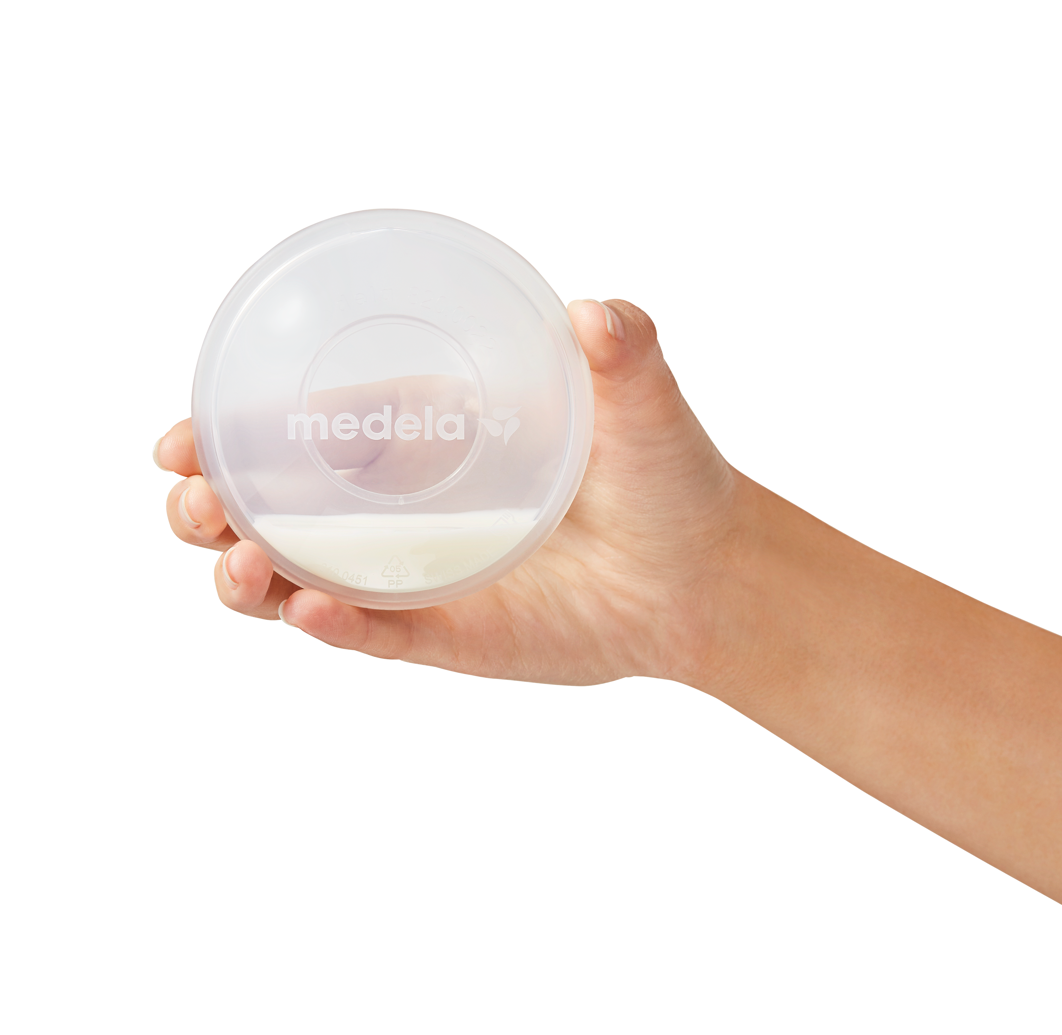 Saved excess breast milk collected in the Medela Milk Collection Shells