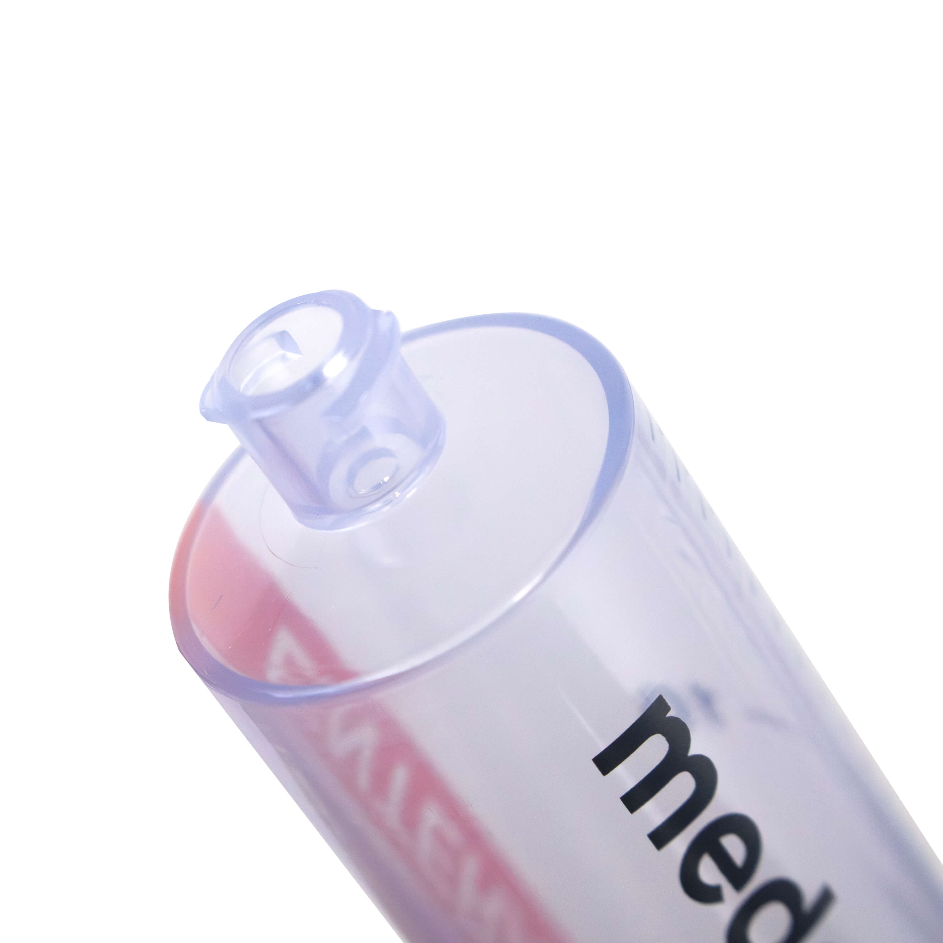 Close up of tip of ENFit syringe with cap removed.