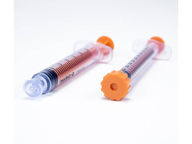 Multiple sizes of syringes both with the cap and with the cap removed.