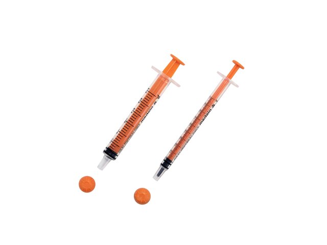 Two sizes of oral slip tip syringes with caps removed.