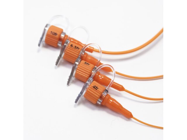Close up of four sizes of ENFit polyurethane feeding tube.  Sizes are 10fr, 6.5fr, 5fr, and 4fr.