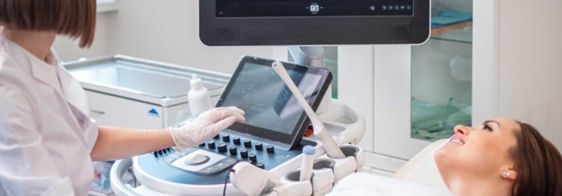 A pregnant woman receiving an ultrasound scan.