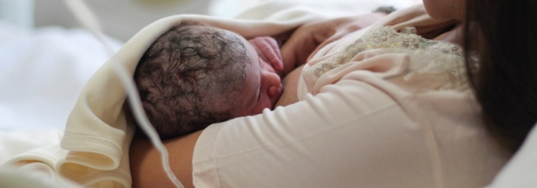 Mum breastfeeding new born