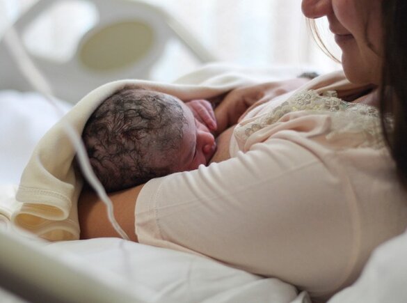 Mum breastfeeding new born