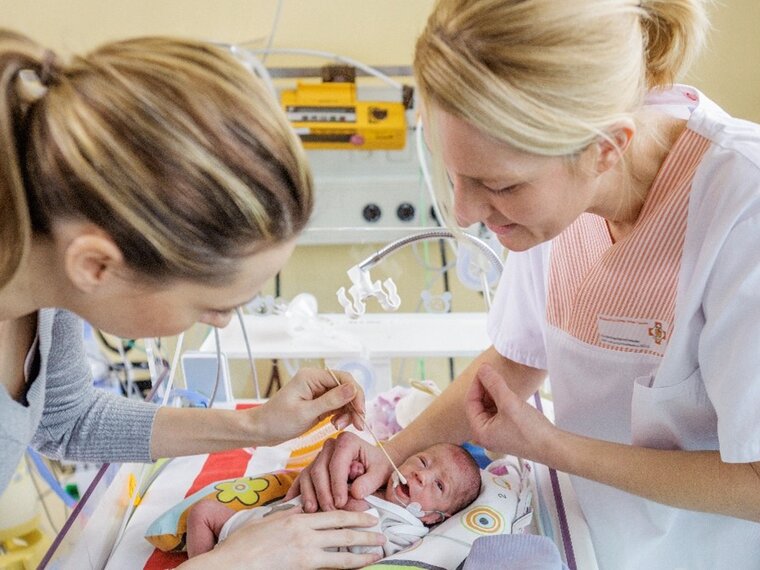 Special Feeding Needs A premature baby receives oral therapy in the NICU.
