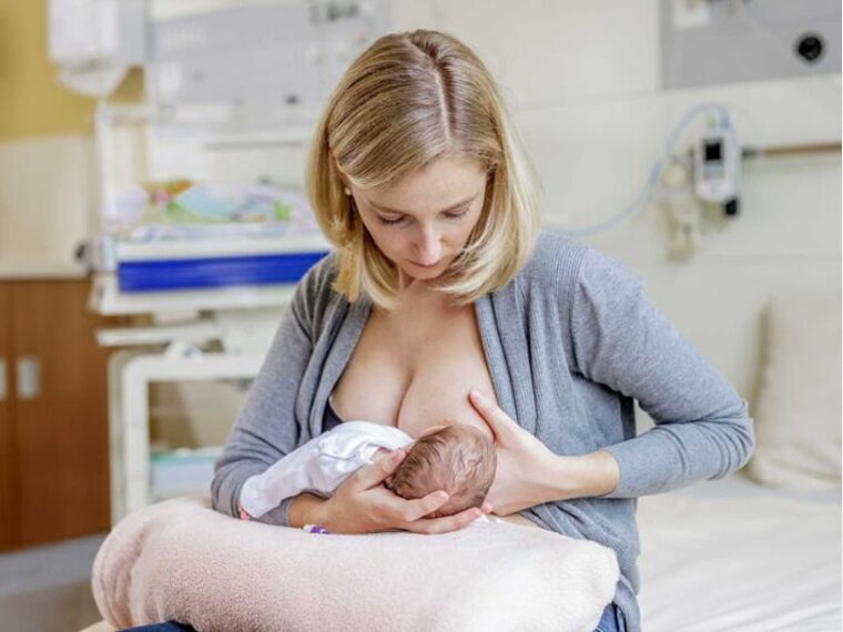 The first days of a mother breastfeeding her newborn in hospital.