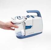 A hand removes a canister from the Medela Clario Toni Pediatric Airway Suction Pump.
