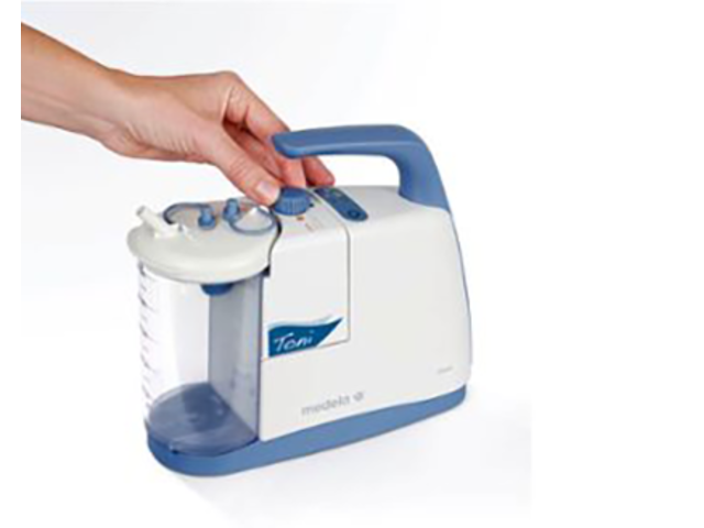 Hand adjusting the vacuum setting on a Medela Clario Toni Pump