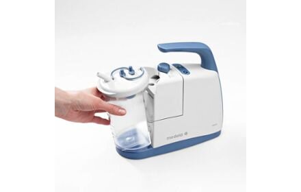 Side view of a person removing a canister from the Medela Clario airway suction pump.