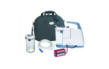 Medela Clario airway suction pump deluxe shown with pump, battery pack, canister, tubing and carry bag.