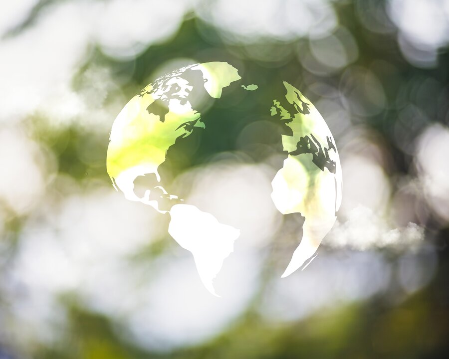 A group of people posing for a photo in a conference room.