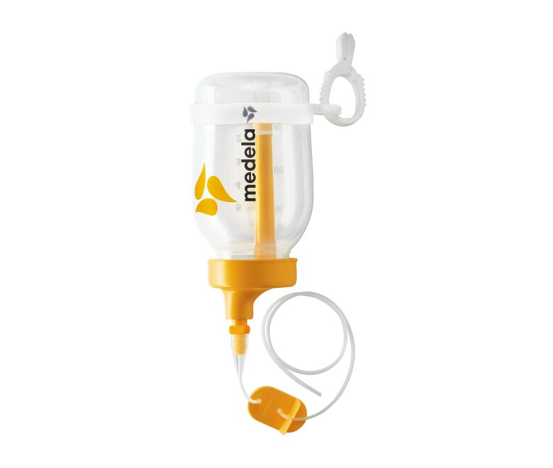 An assembled Supplemental Nursing System™ (SNS) with the associated parts.