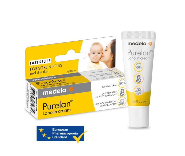 Un tubetto da 7 g di crema alla lanolina Purelan™ di Medela accanto alla sua confezione al dettaglio. Include anche il testo “European Pharmacopoeia Standard”.