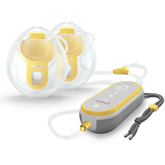 Pompe mains libres Medela Freestyle présentée avec les bonnets de recueil mains libres.