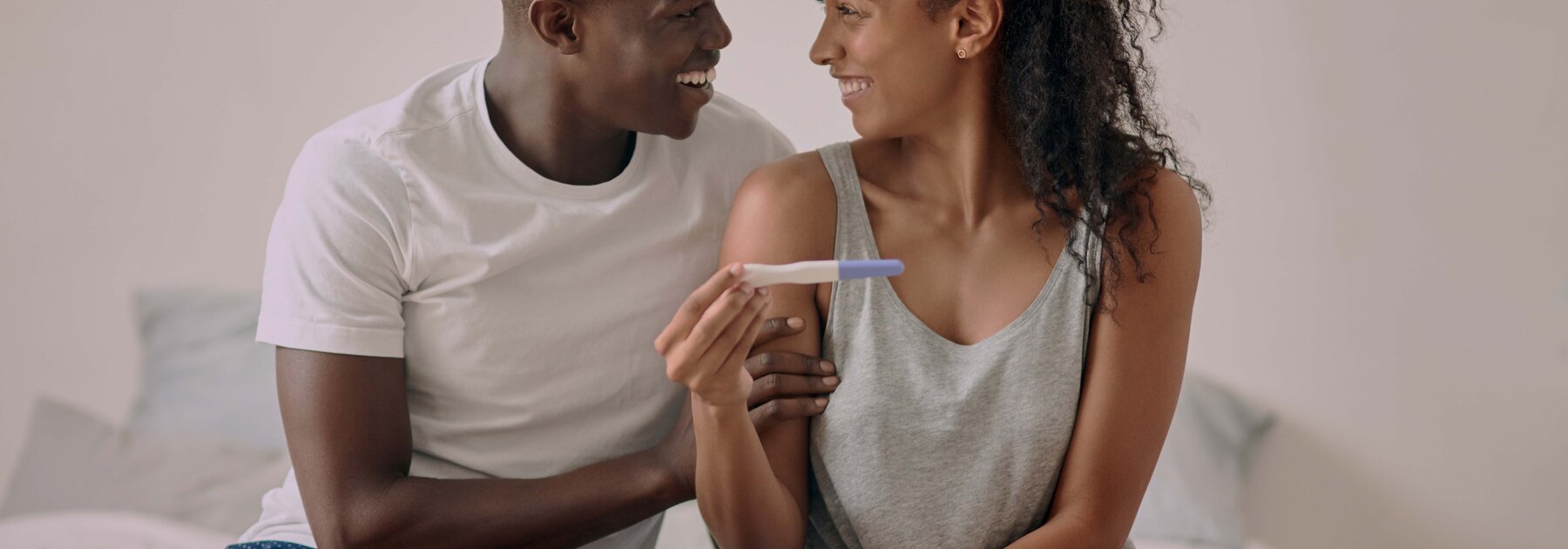 The partners are excited with the results of the pregnancy test.
