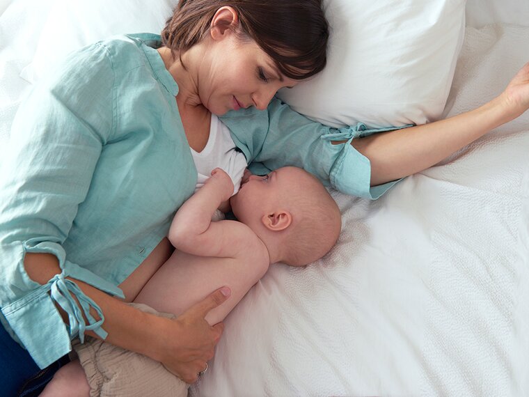 Mother breastfeeding her baby, highlighting the benefits for both mother and child