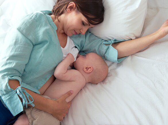 Mother breastfeeding her baby, highlighting the benefits for both mother and child