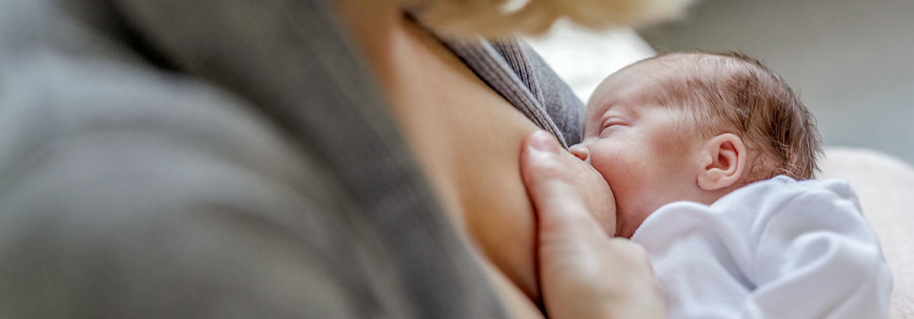 Breastfeeding A mom breastfeeds her premature baby.
